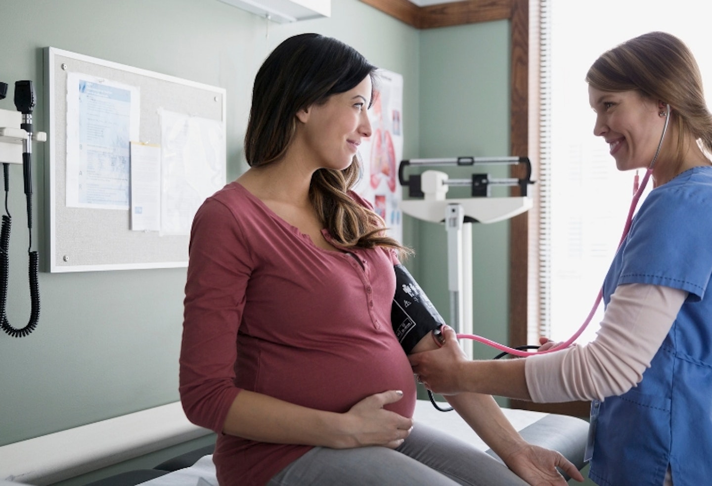 Pregnant woman seeing doctor