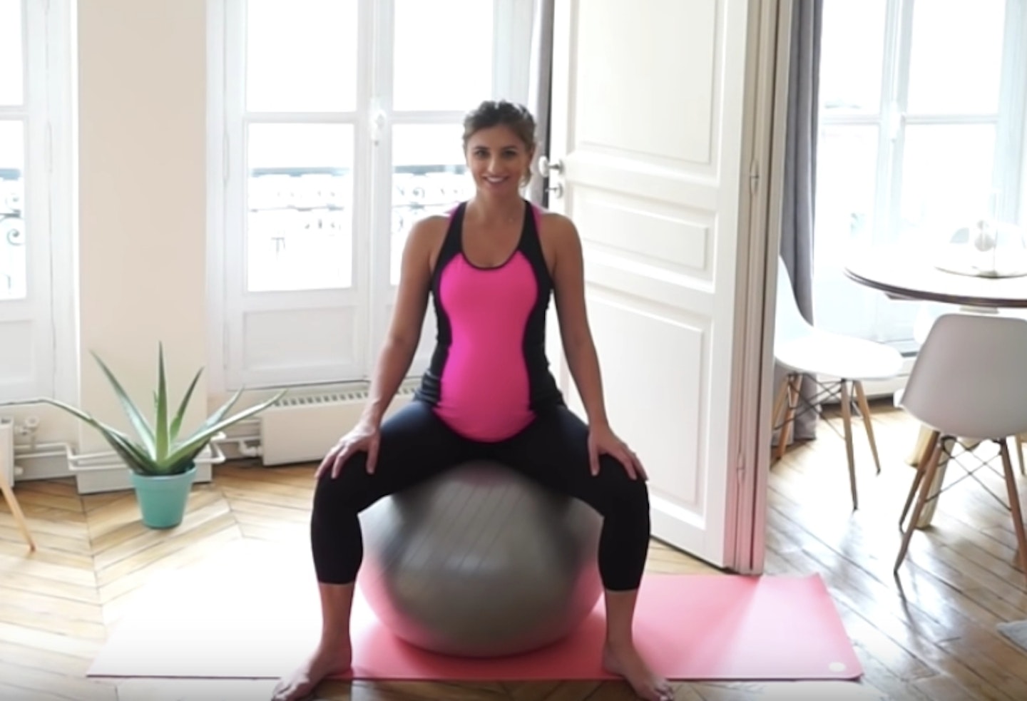 pregnant woman sat on exercise ball
