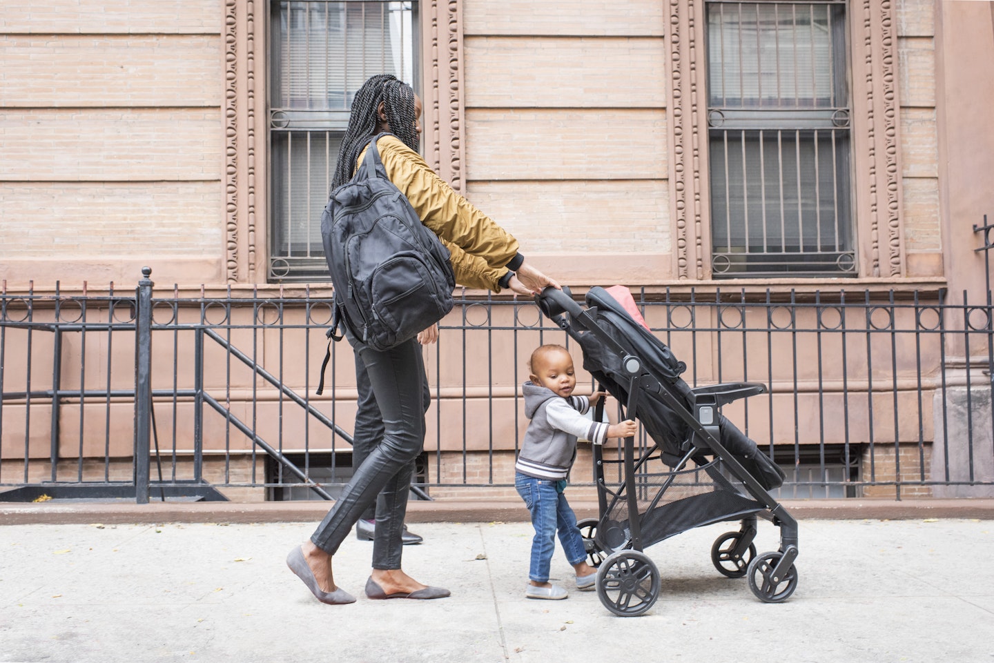 Woman walking with her stroller