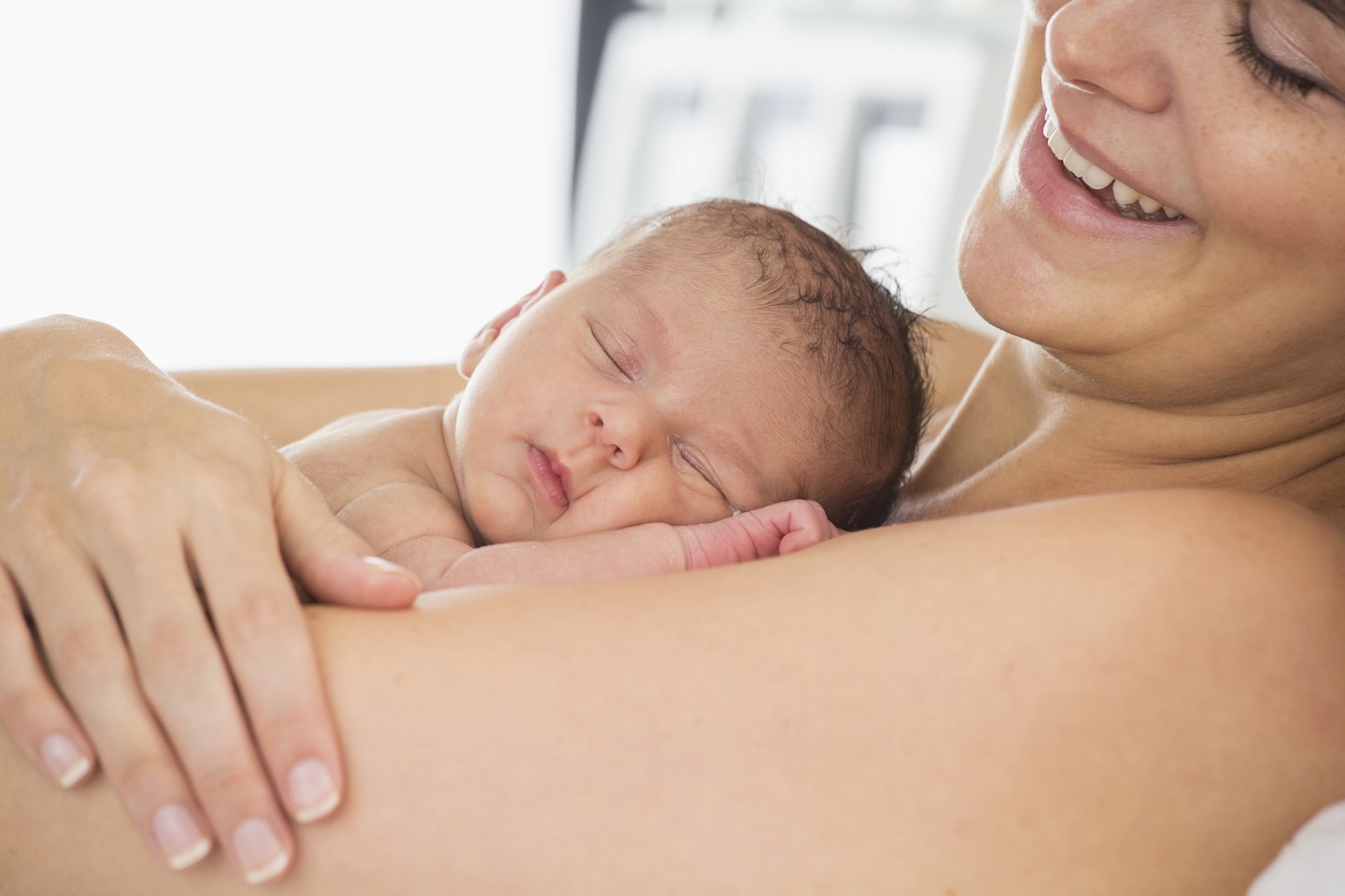 woman holding newborn baby