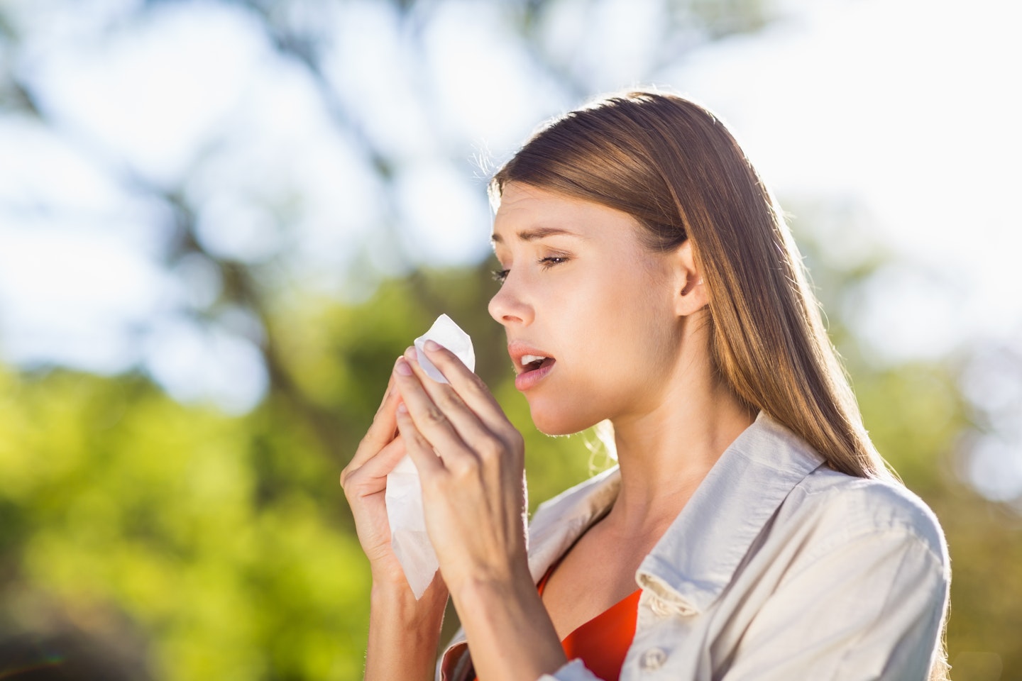 Woman sneezing