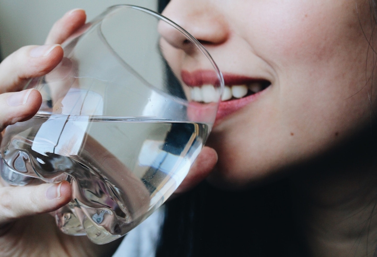 woman drinking glass of water