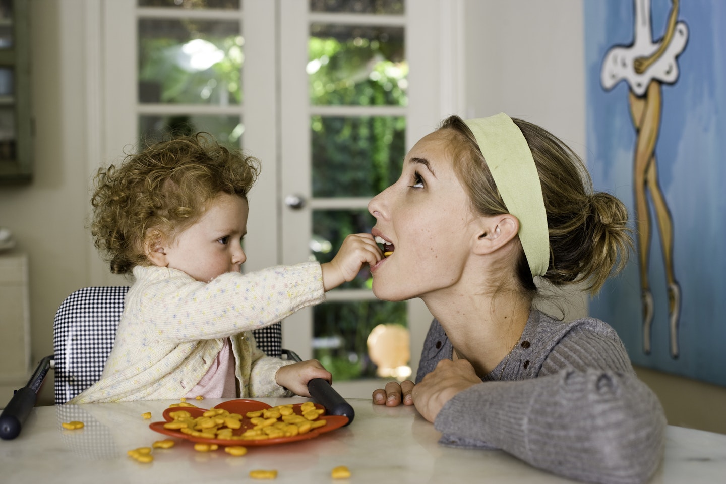 toddler and mum eating together