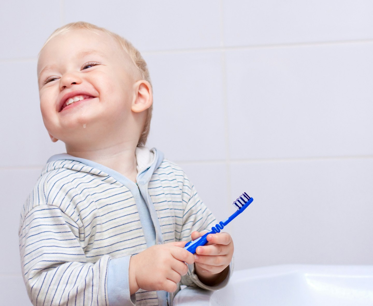 Toddler brushing his teeth