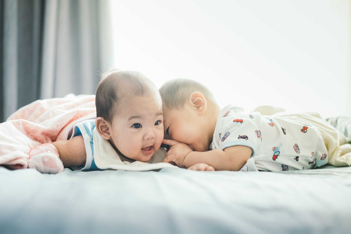 Happy twins smiling