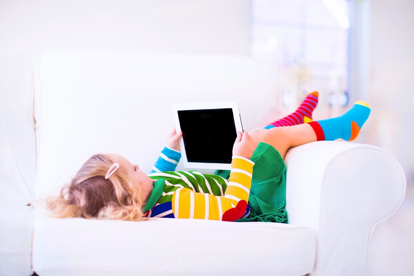 girl playing on a tablet