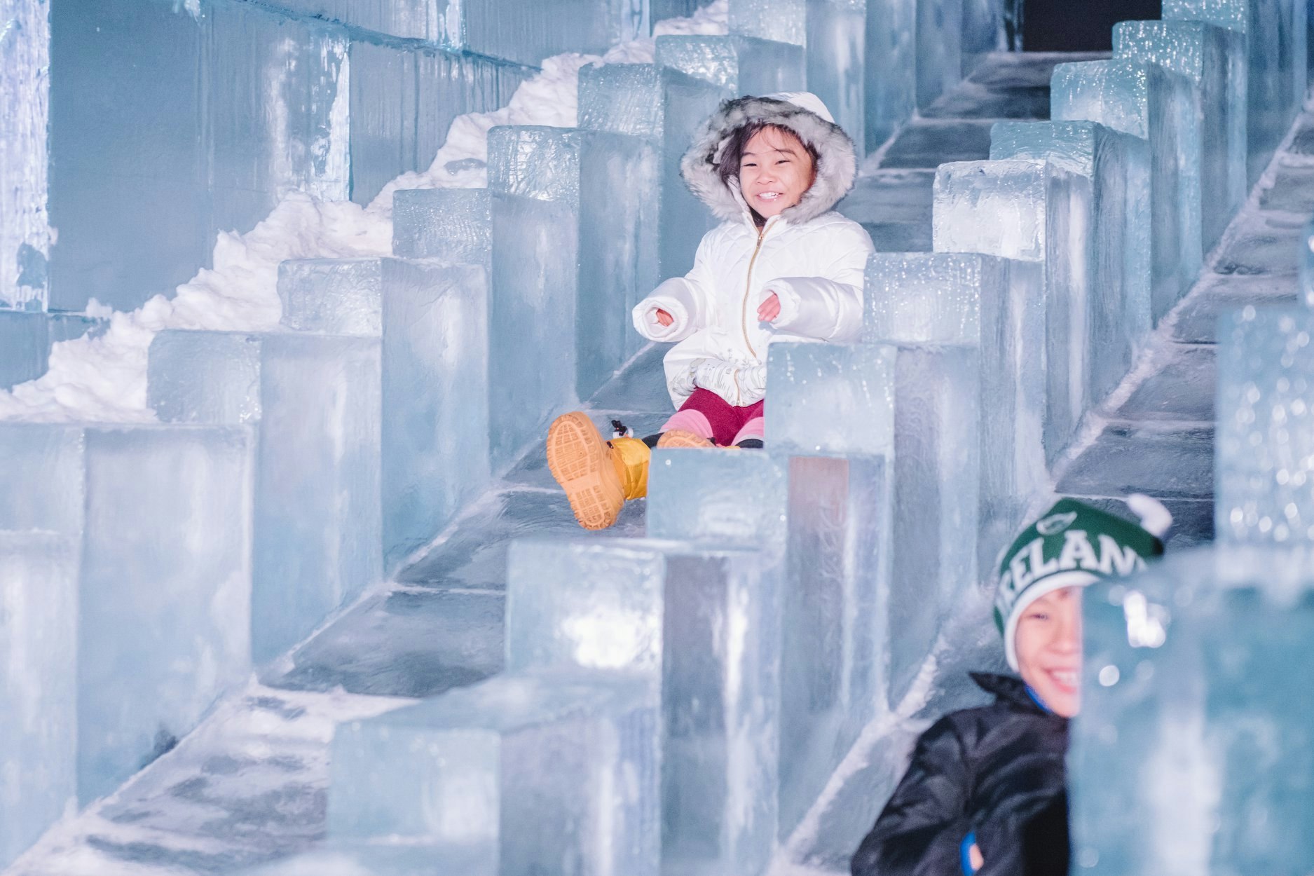Children enjoying the ice slide at Winter Wonderland