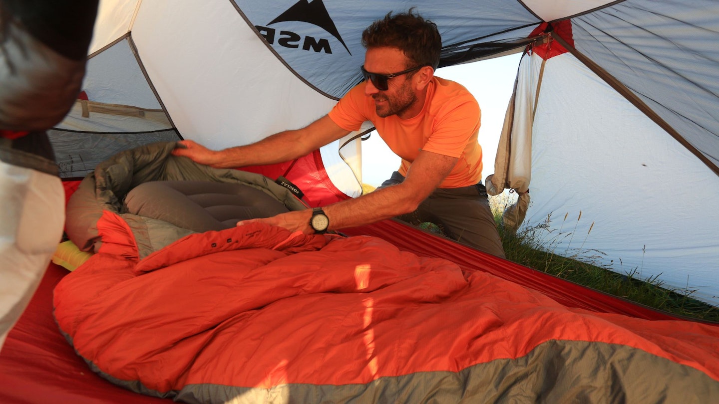 Putting sleeping bag and sleeping mat into a tent