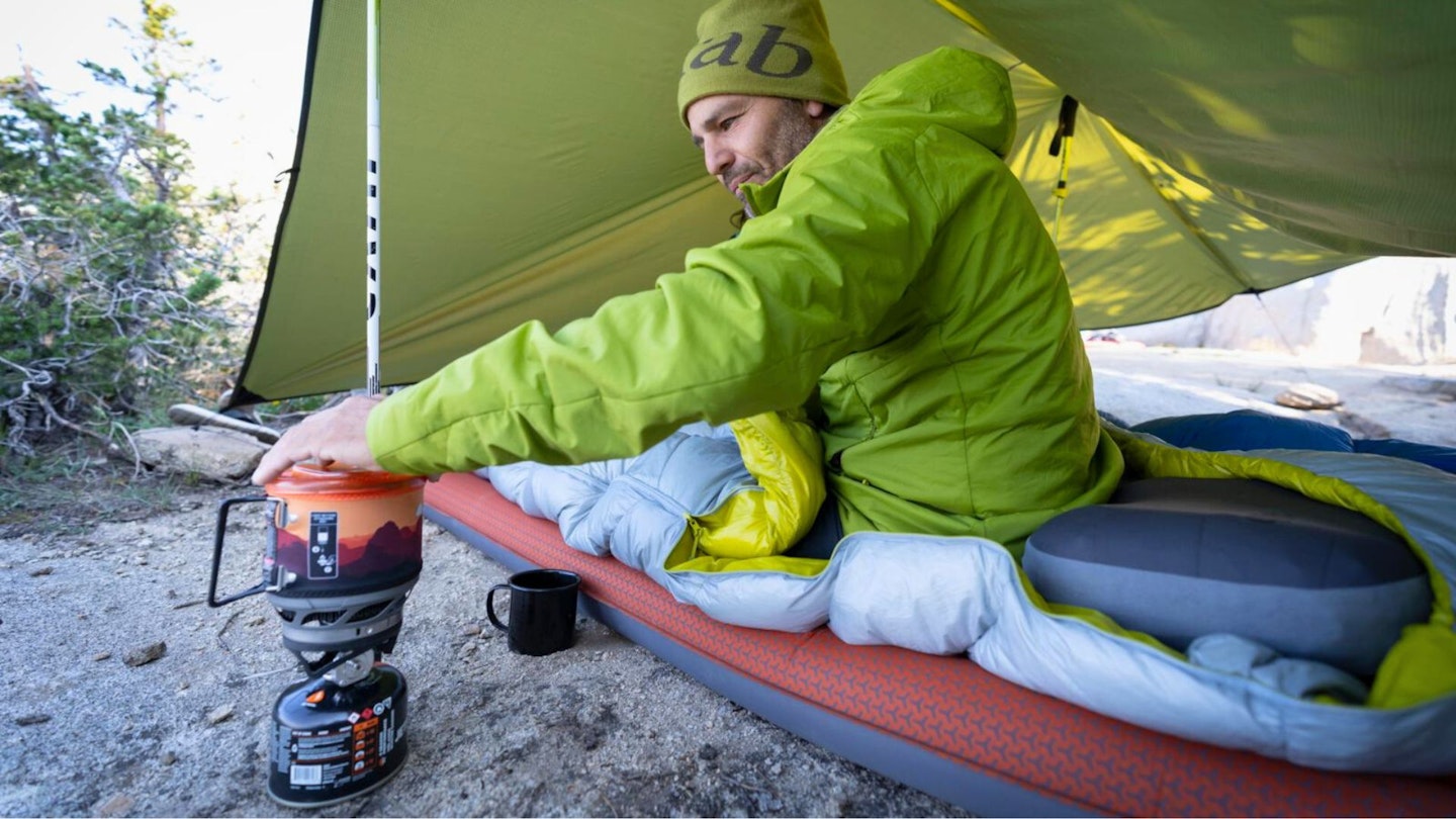 Hiker using a camping pillow