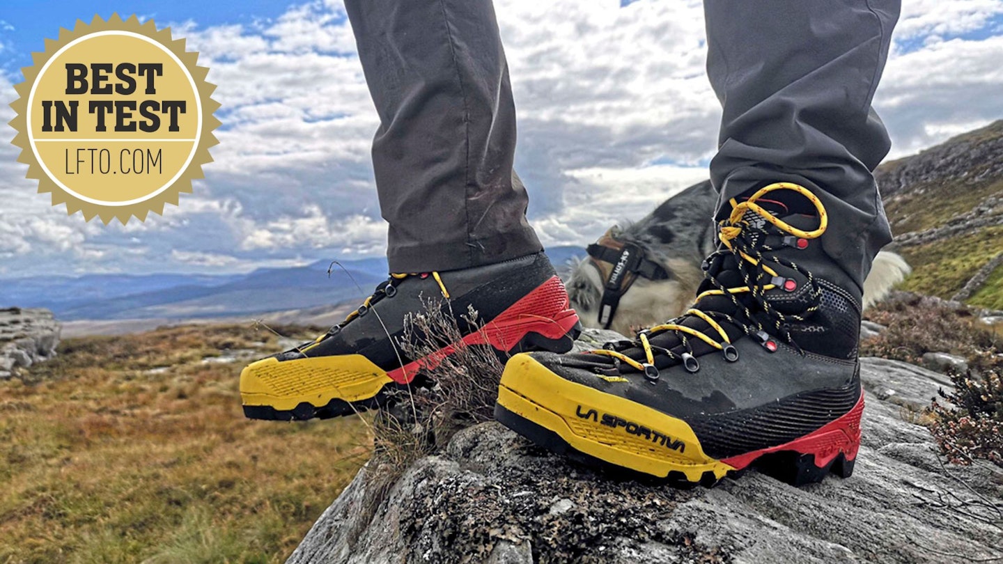 La Sportiva Aequilibrium LT GTX standing on a rock with Best in Test award logo