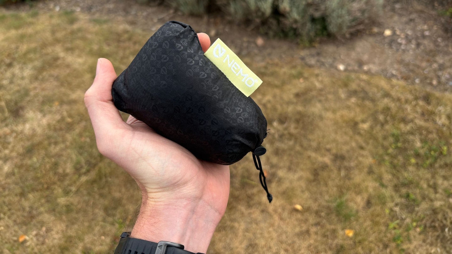 Nemo Fillo Elite Pillow packed down into a hand