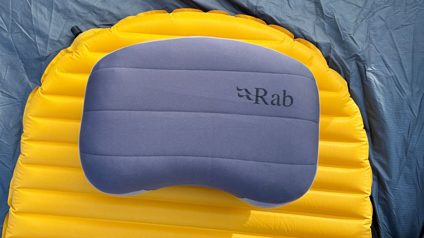 Rab Stratosphere Inflatable Pillow lying ontop of a sleeping mat