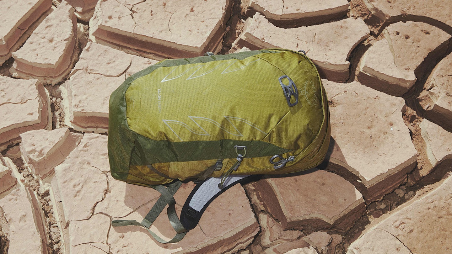 Osprey Talon Earth 22 on dry cracked sand river bed