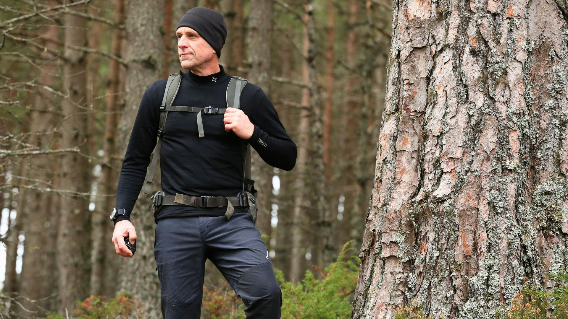 Hiker wearing a black base layer