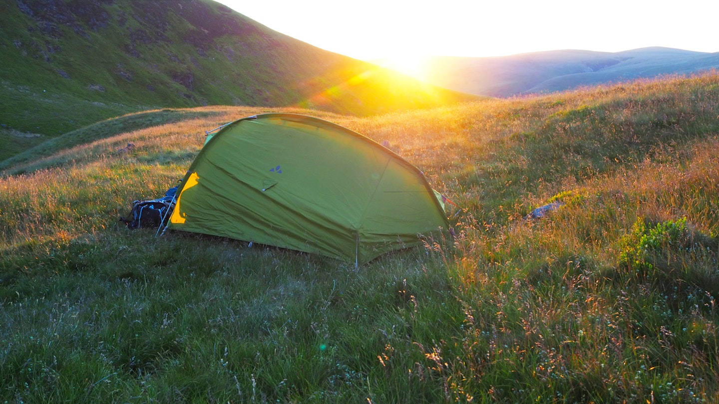 Vaude 3-person tent on a hill at sunset