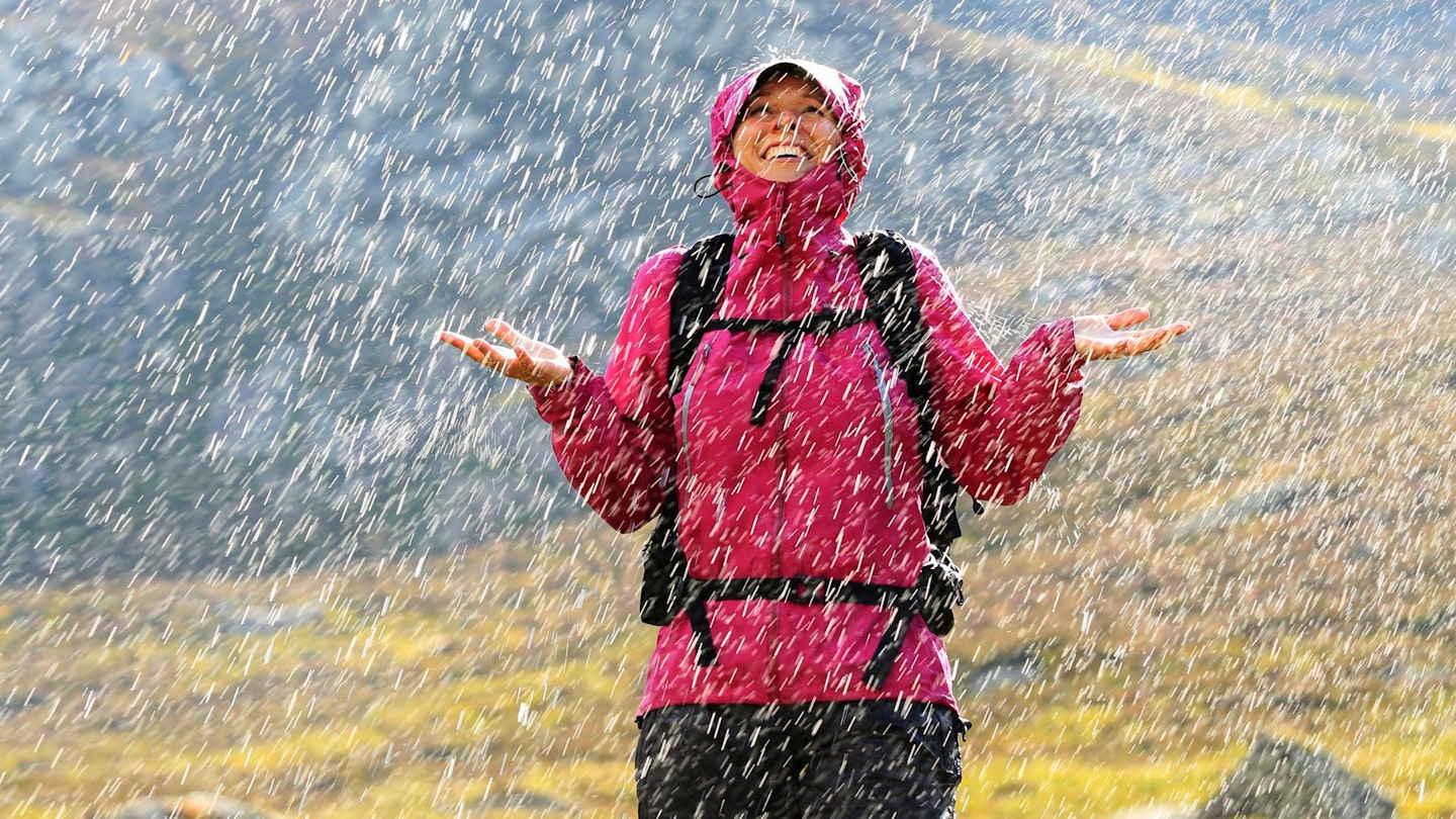 Hiker caught in a sunny rain shower