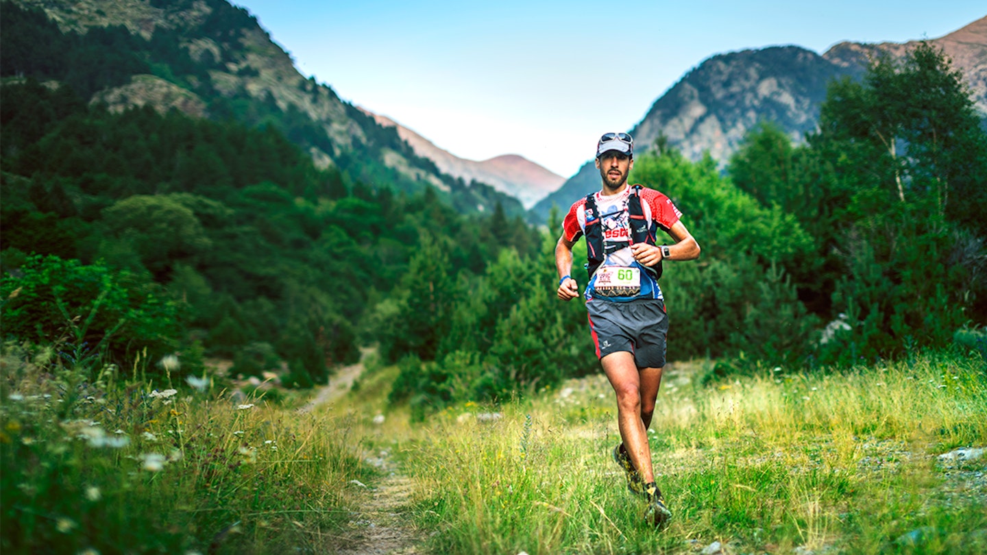 man runs along a 10km trail in the mountains