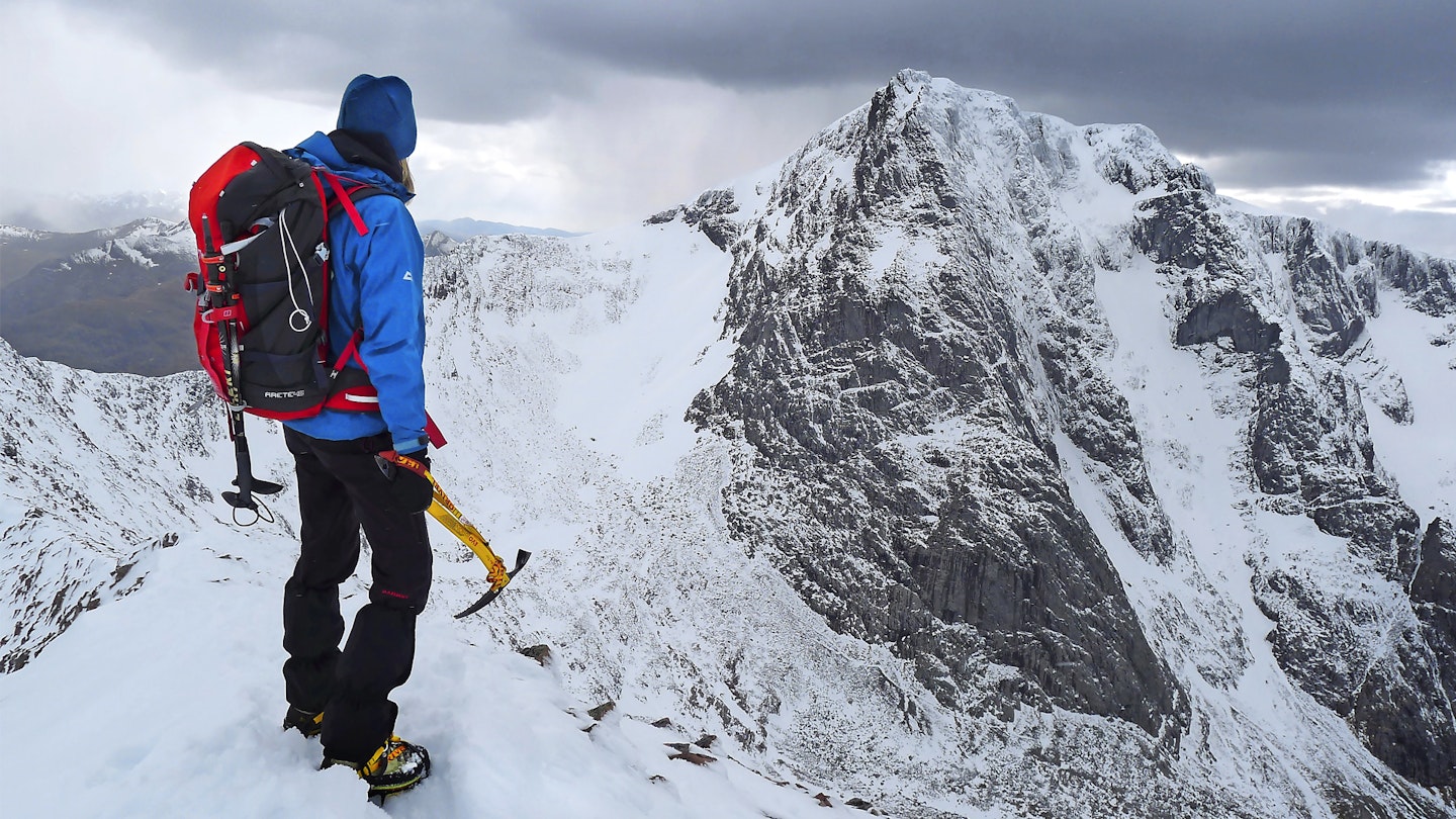 Mountaineer on ben nevis wearing a winter backpack