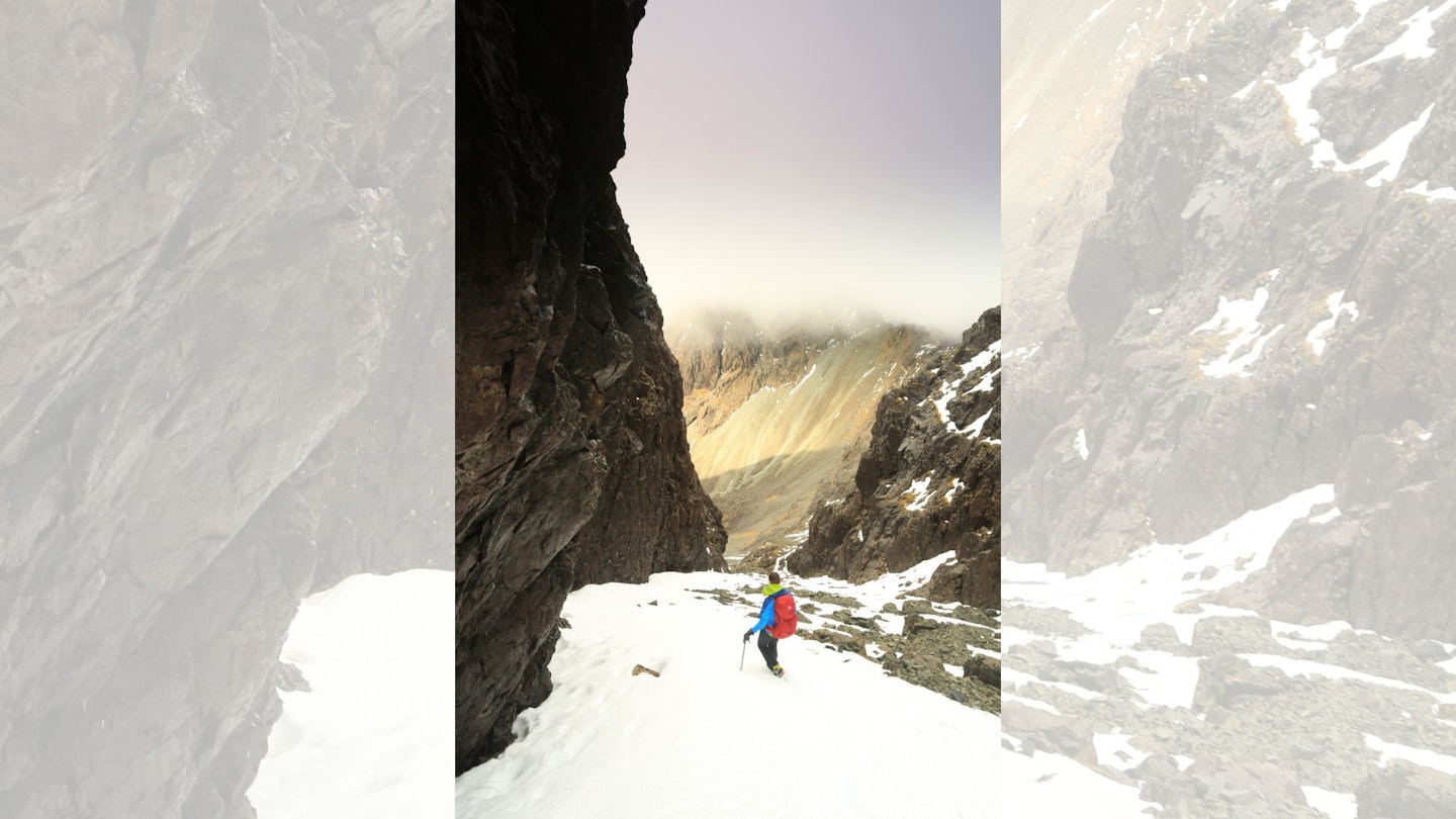 Hiker descending down Great Stone Chute, Isle of Skye