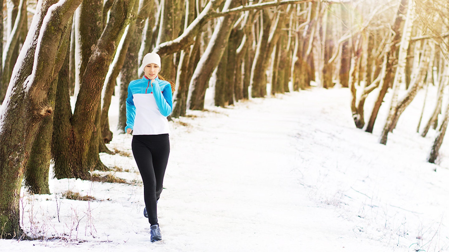 woman runs in snow