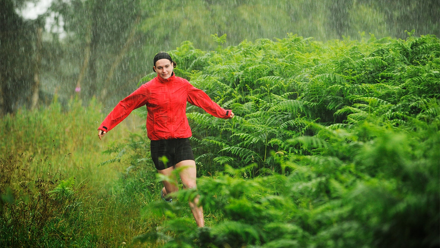 woman runs in the rain