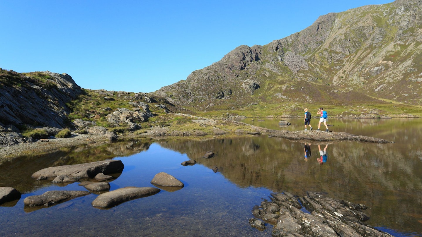 Walkers at Llyn y Foel & Daear Ddu ridge Moel Siabod Snowdonia