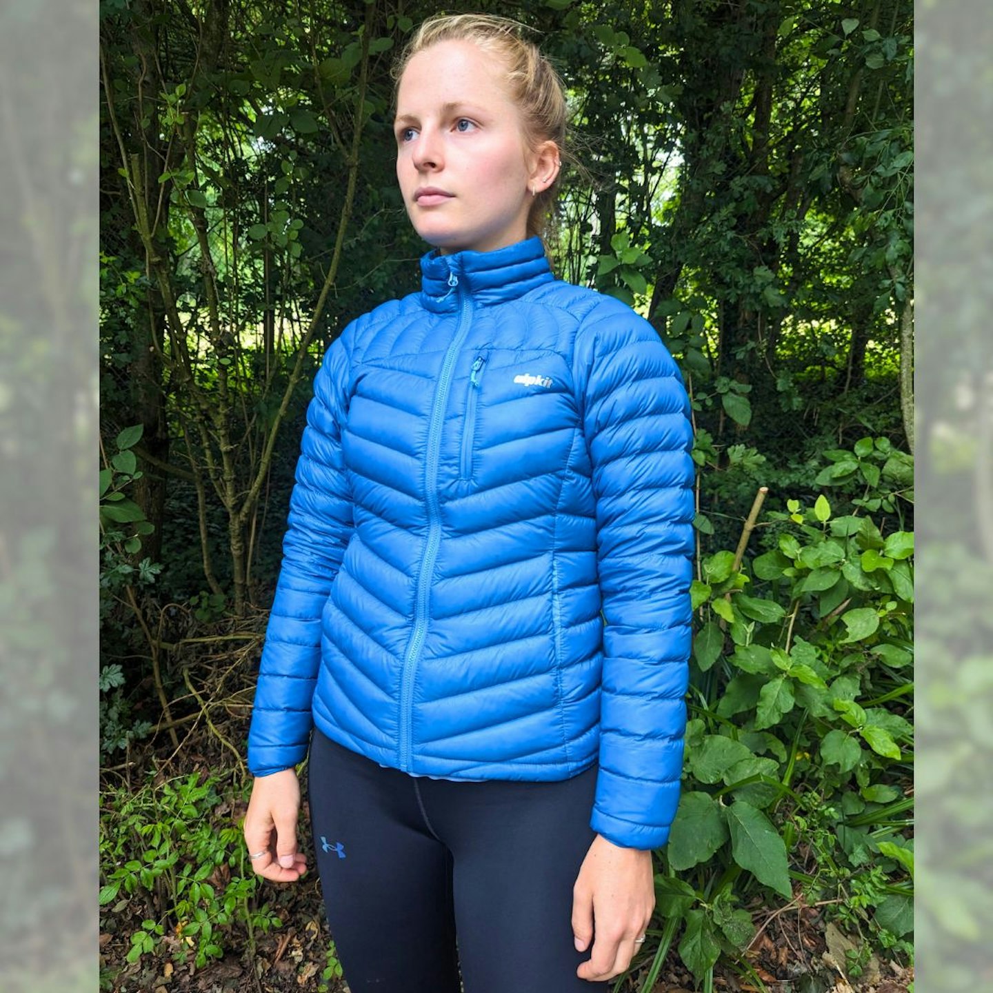 Female hiker wearing blue Alpkit Halogen jacket