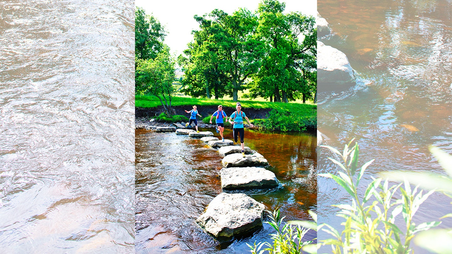 runners on trail across river in swaledale