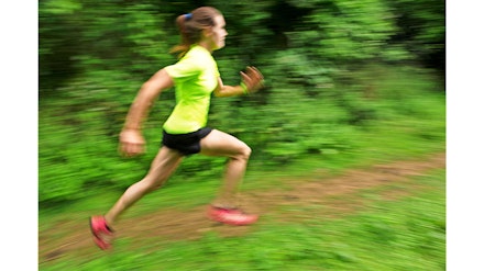 woman runs very fast with blurry background