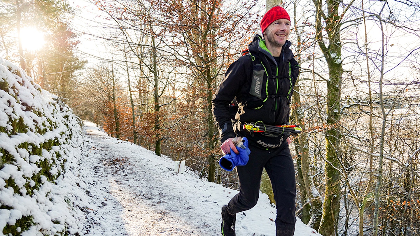 hall runs along snow in spine race