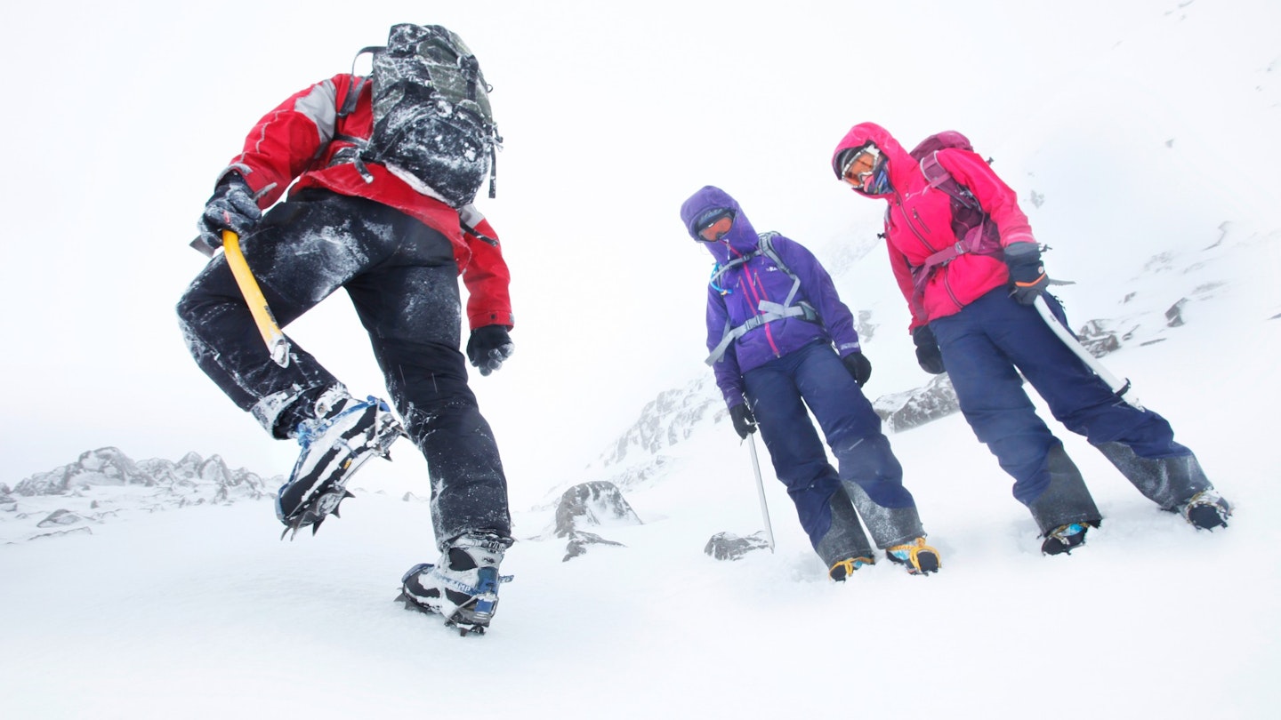 Hikers in snow with crampons