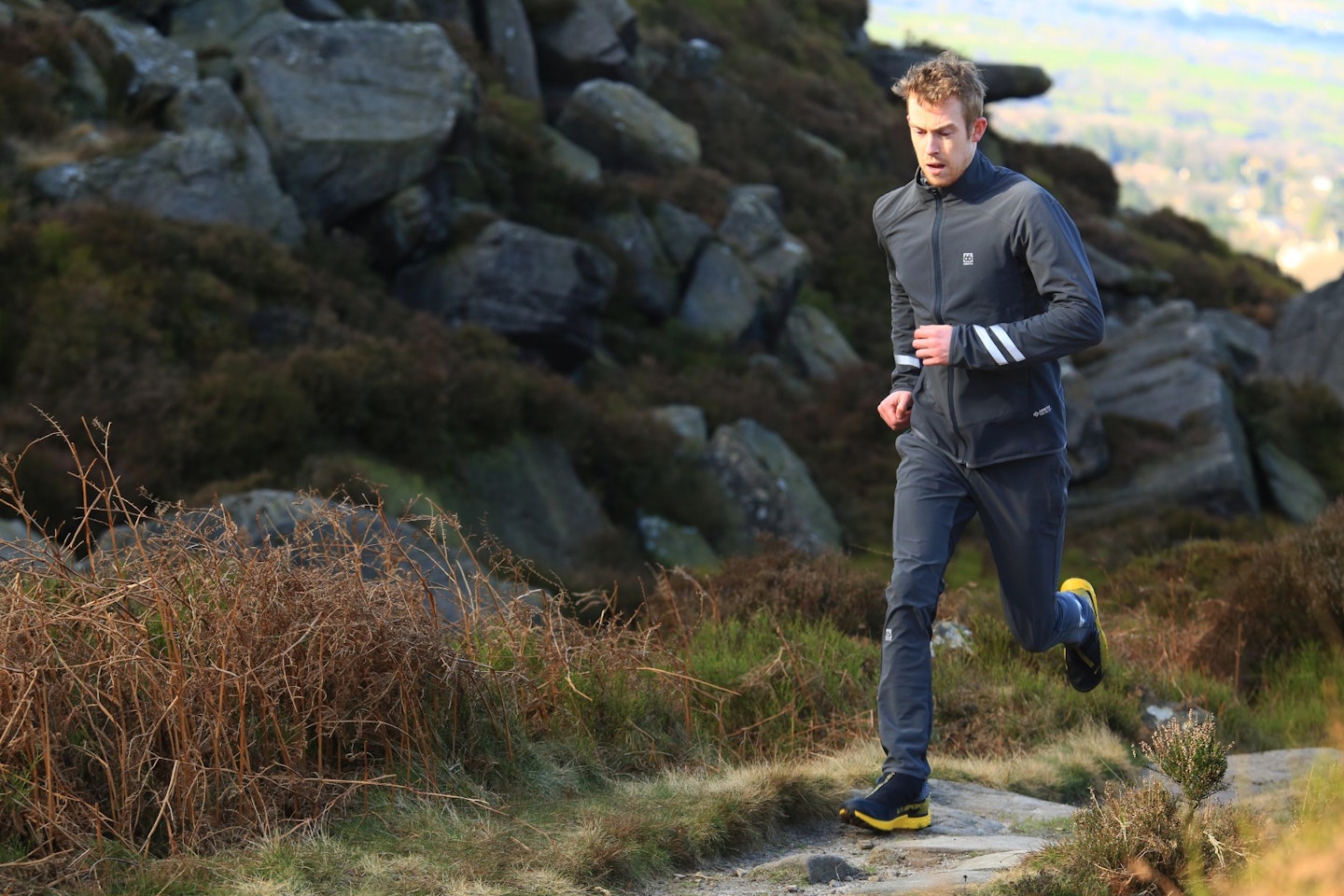 Male runner wearing 66Deg North Straumnes gear