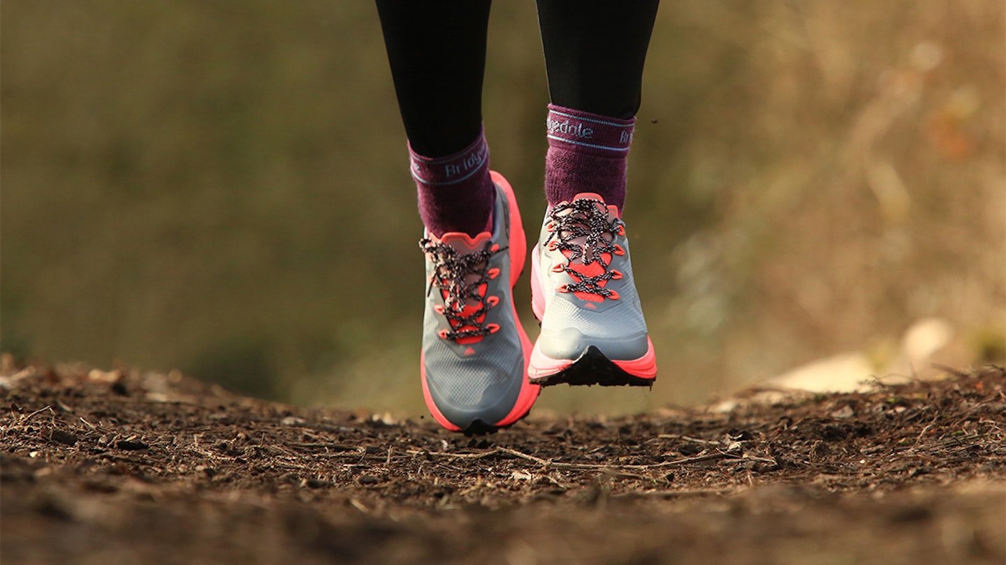 runner in bridgedale socks, focus on feet