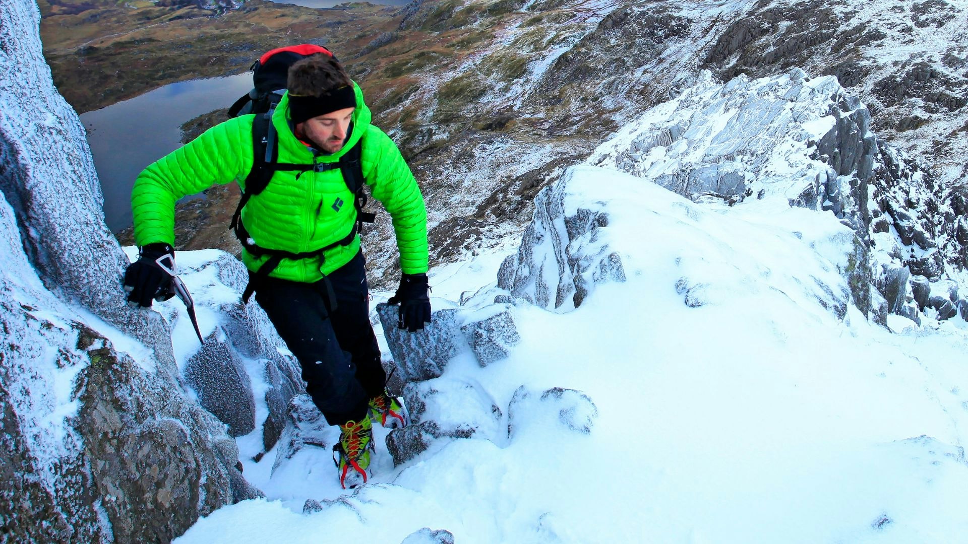 Scrambling up a mountain in winter