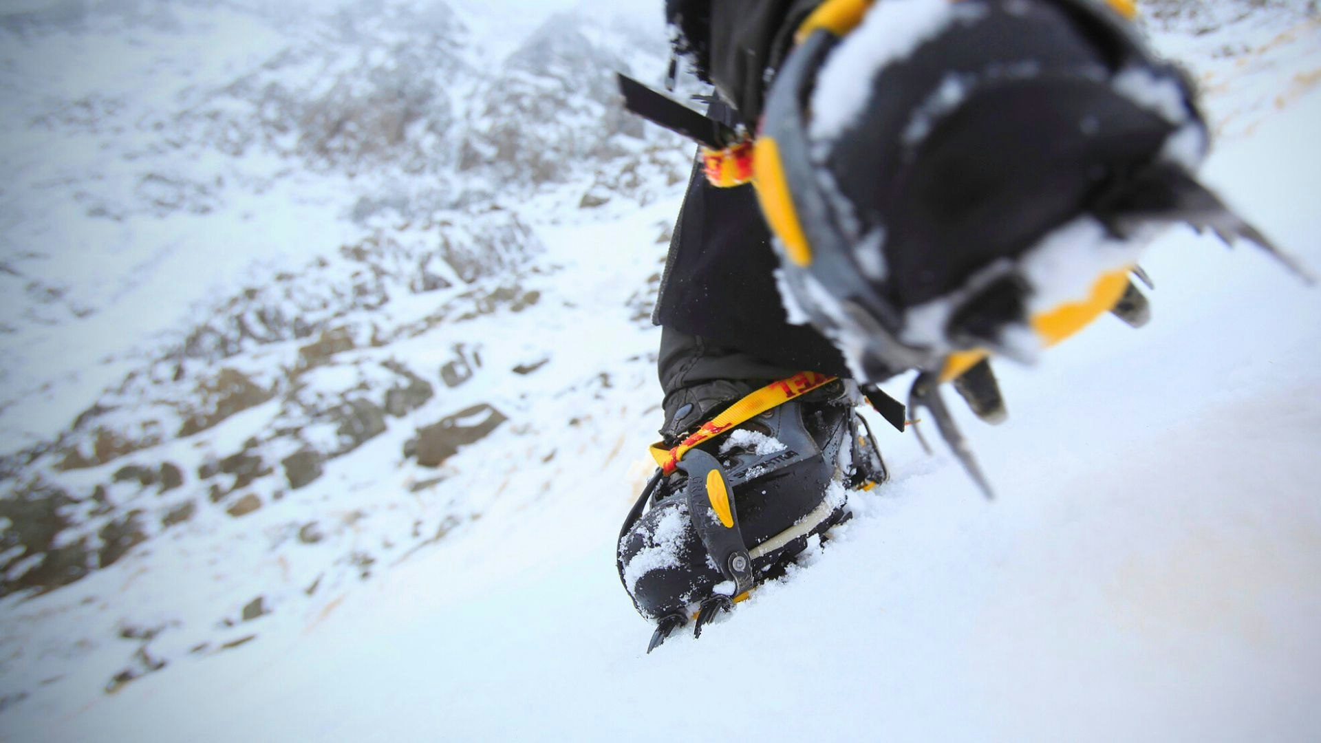 Closeup of crampons fitted to boots
