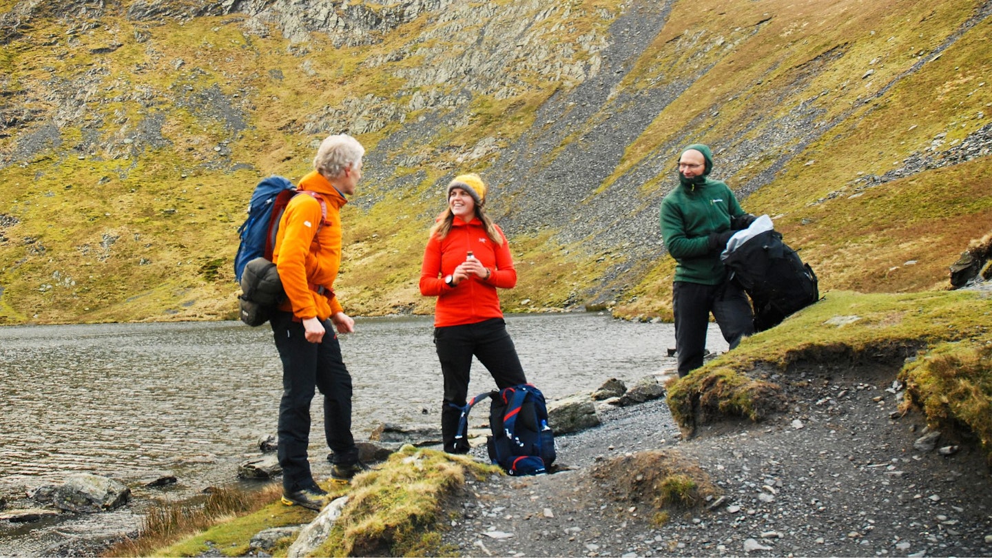 Three hikers wearing fleeces