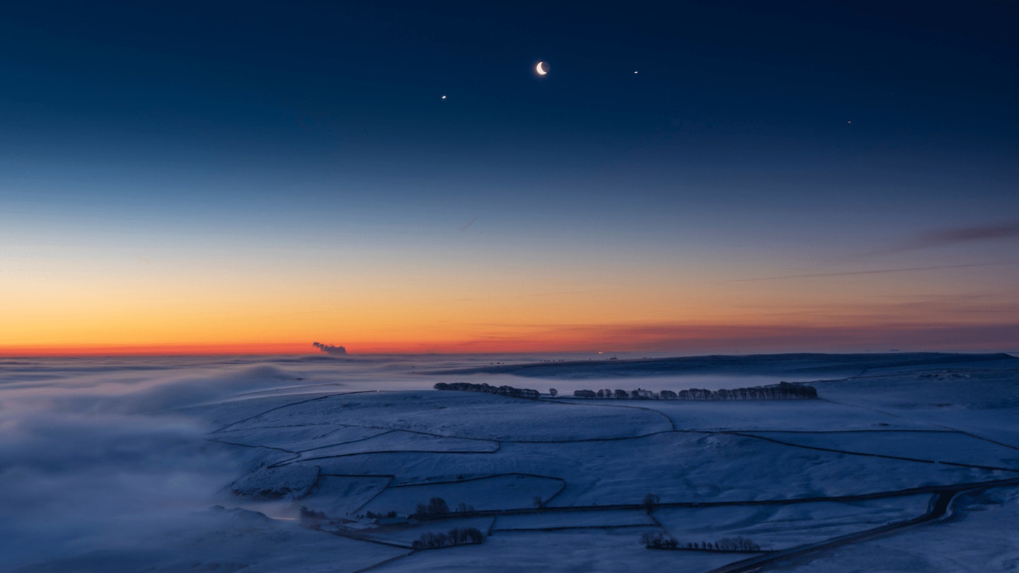 Venus, Moon, and Jupiter in the sky above Peak District, UK