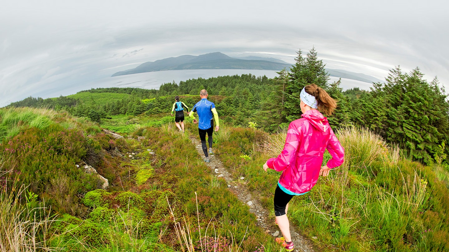 three runners on the trails