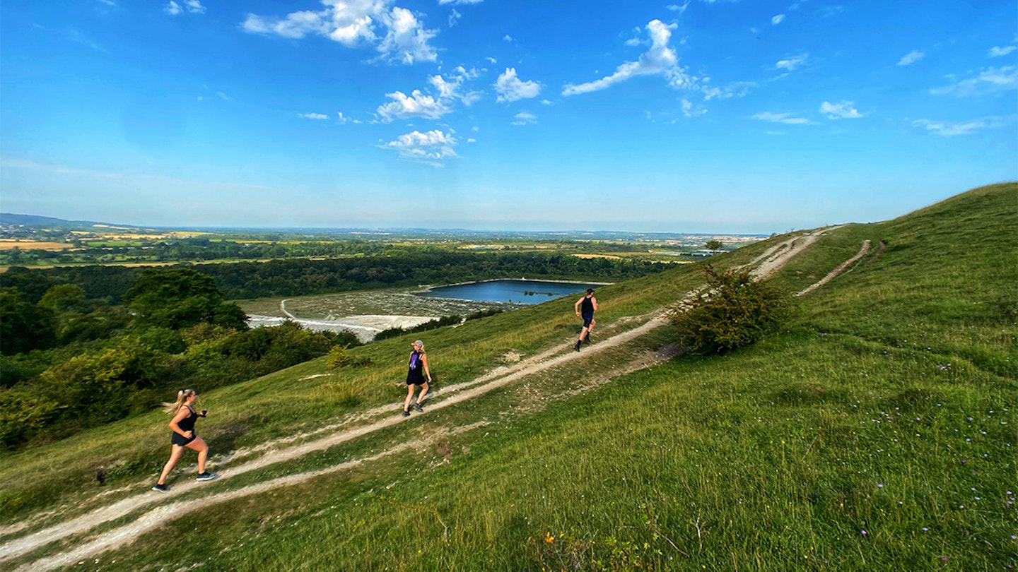 three runners in a field