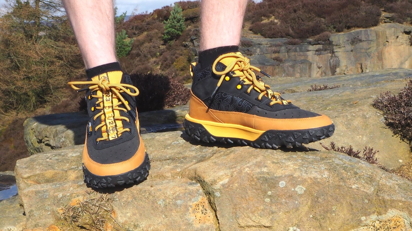 Standing on a rock wearing Timberland Motion 6 shoes