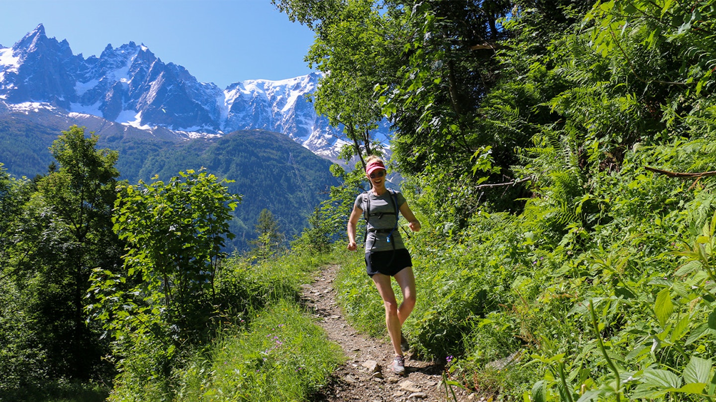 woman runs in alps