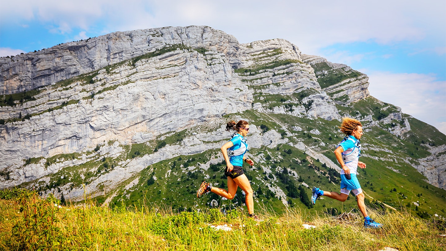 two runners in the dolomites