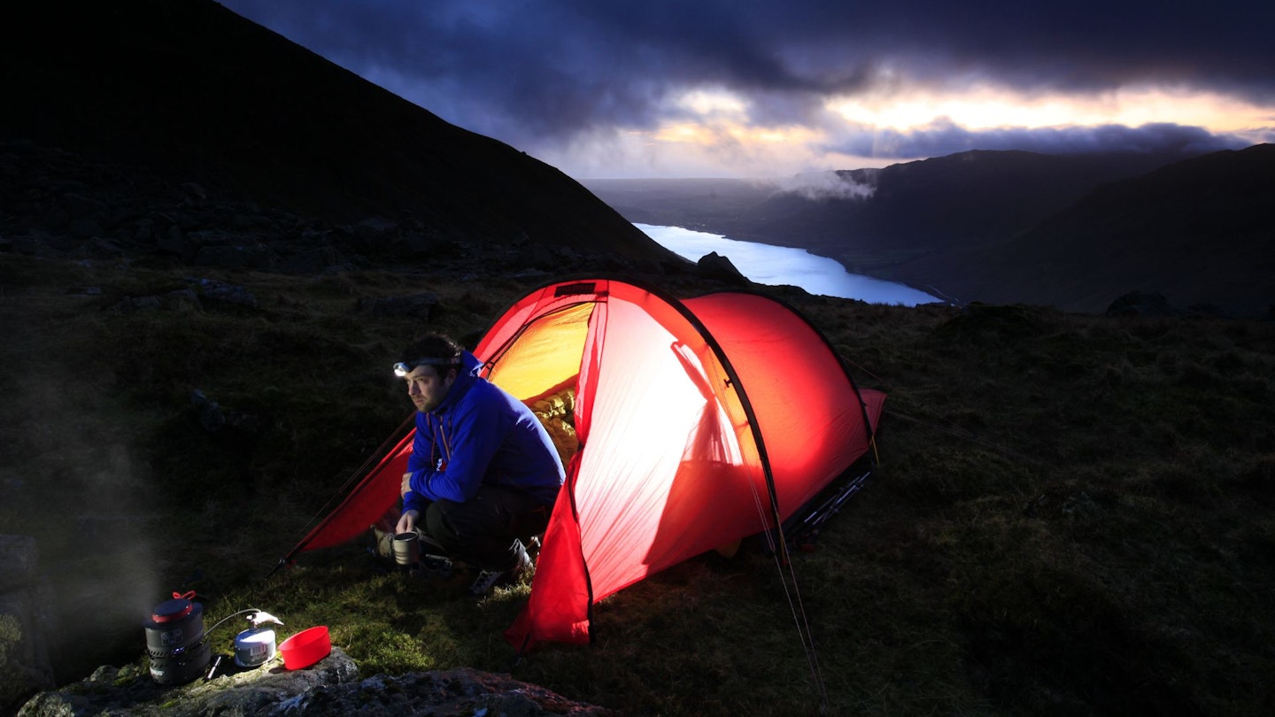 Wild camping at dawn, cooking with camping gadgets