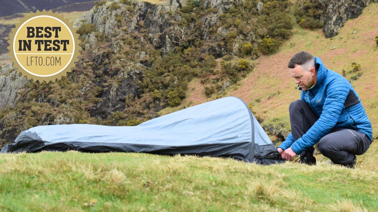 A photo of James Forrest pitching the Outdoor Research Helium Bivy with LFTO Best in Test award logo
