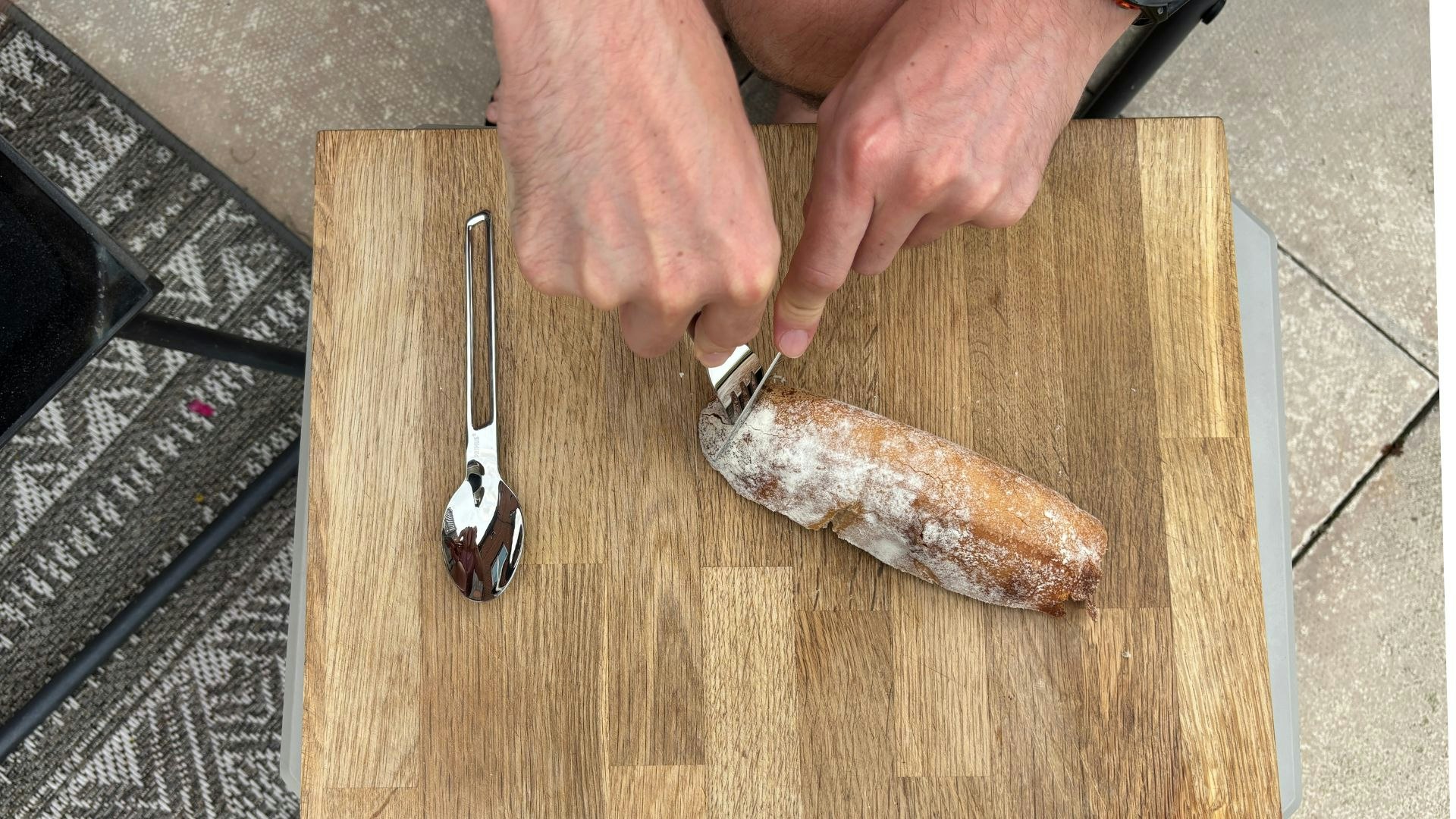 Cutting sourdough with camping cutlery