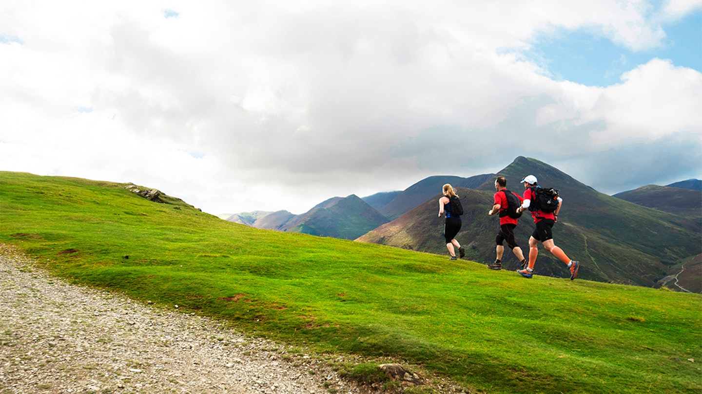 runners on a hill