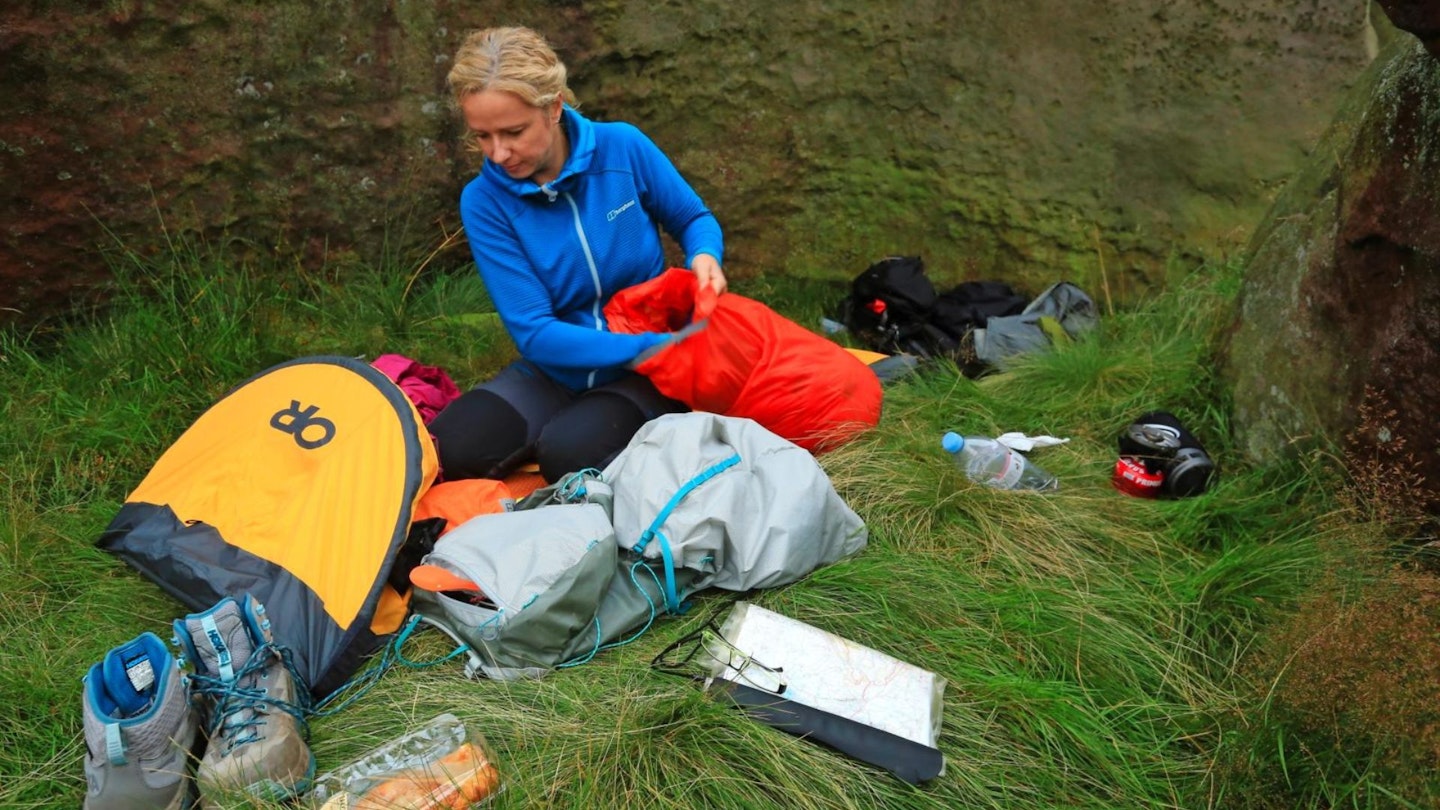 Packing up after a night bivvying in a bivvy bag