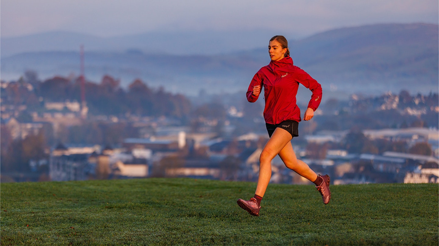 woman runs in INOV-8 PARKCLAW G 280