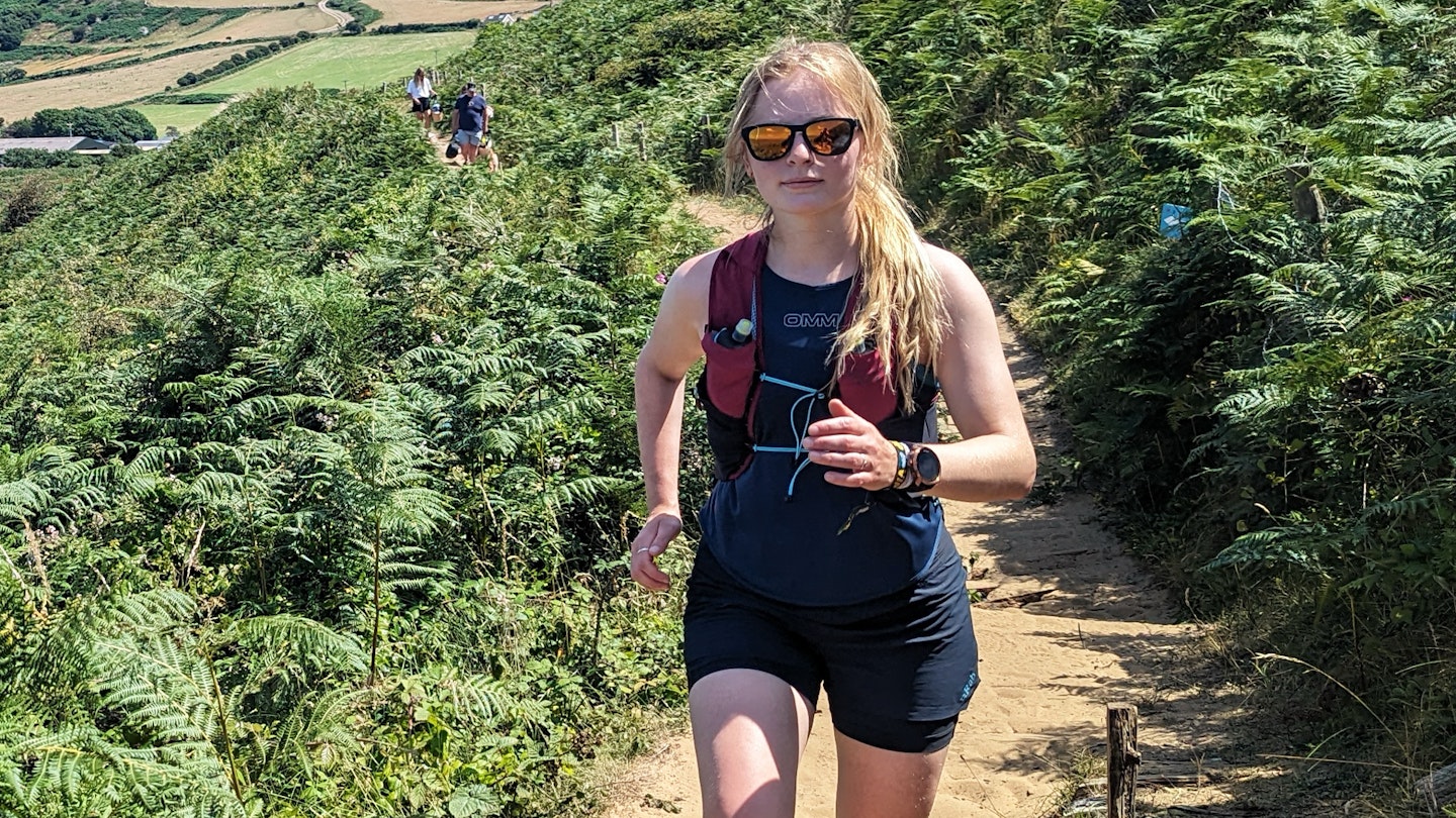 Kate Milsom wearing the OMM Nitro Tank running top