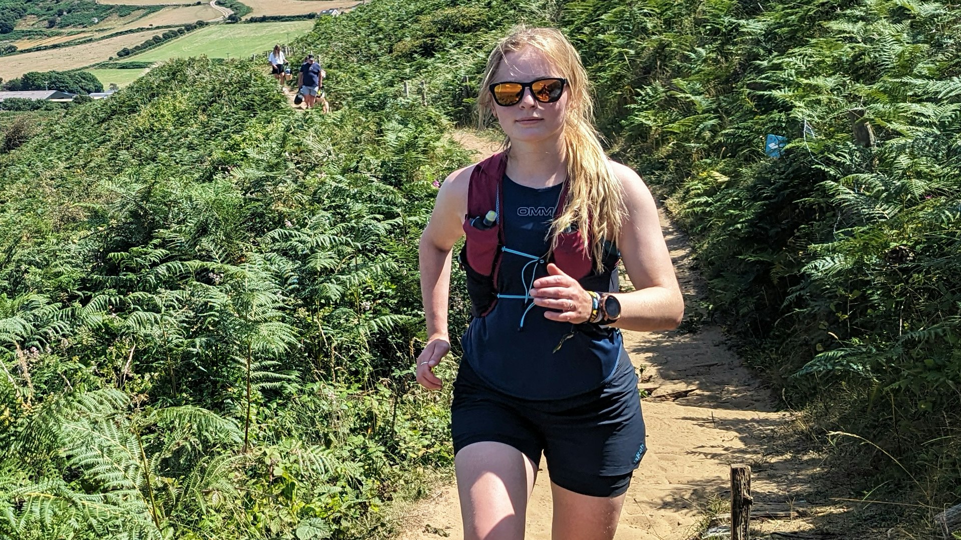 Kate Milsom wearing the OMM Nitro Tank running top